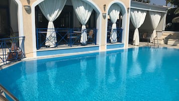 Outdoor pool, pool umbrellas, pool loungers