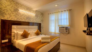 Habitación ejecutiva doble, vistas a la ciudad | Sala de estar | Una televisión de pantalla plana