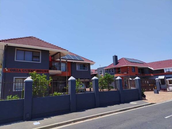 A two-story building with a sign reading 'ORIA GUEST HOUSE.' - Oria Guesthouse (Cape Town)