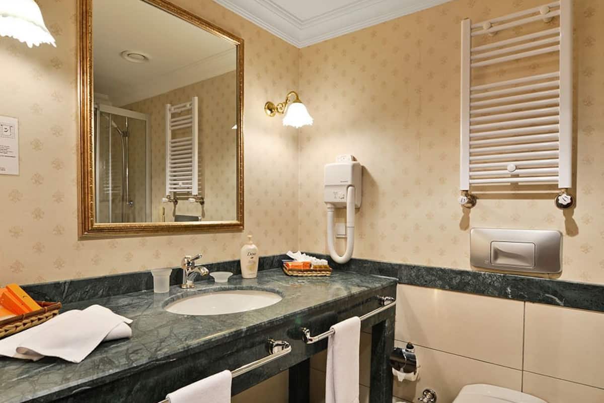 royal suite | bathroom | deep-soaking bathtub, free toiletries, hair dryer, bathrobes