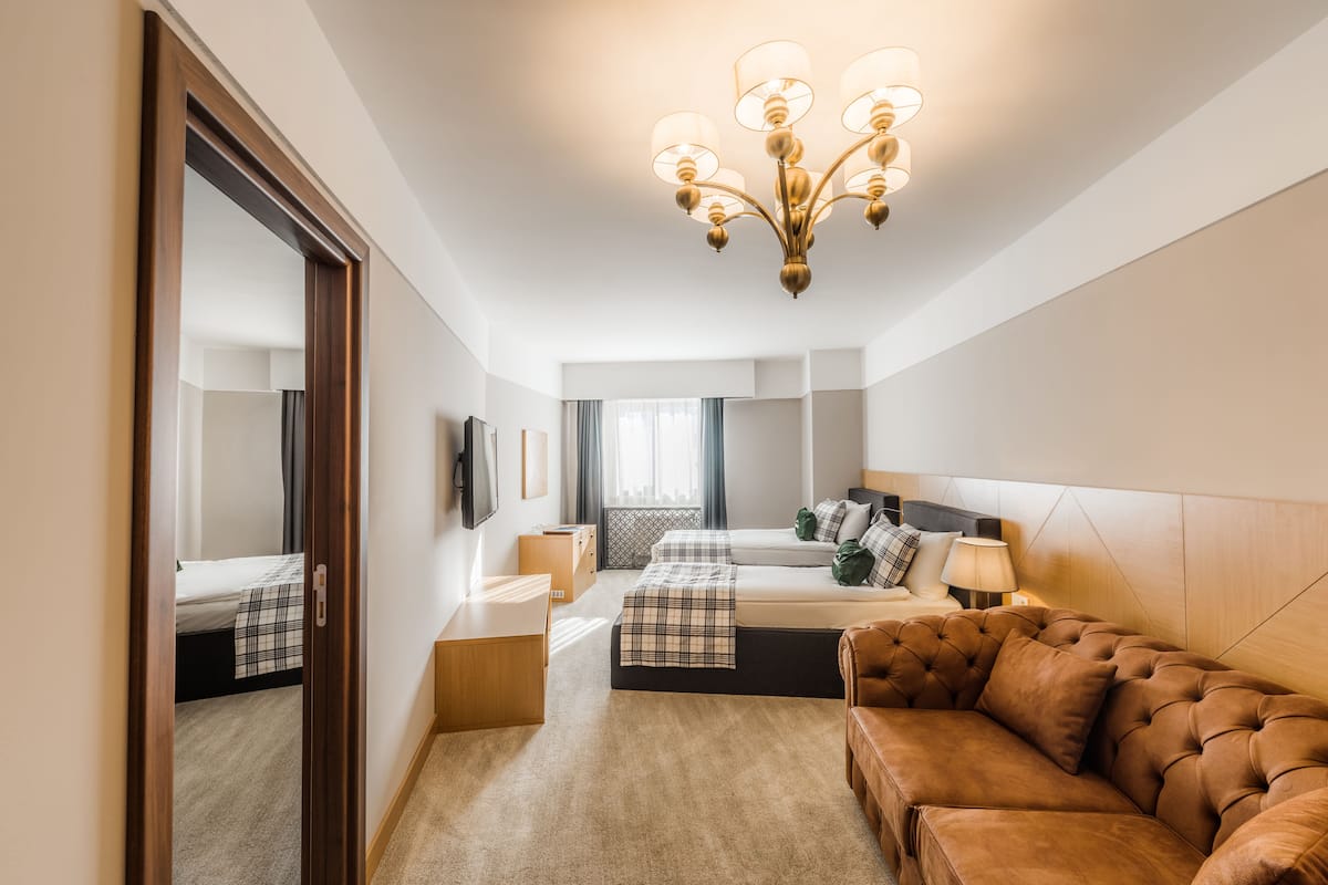 deluxe triple room | premium bedding, minibar, in-room safe, desk