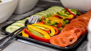 A tray of sliced vegetables including cucumbers, tomatoes, and bell peppers. - Trip Inn Hotel Münster City (Münster)
