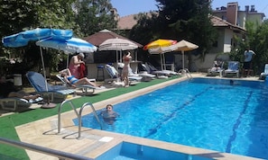 Seasonal outdoor pool, pool umbrellas, pool loungers