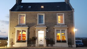 A two-story stone building with three windows on the ground floor and two on the upper floor. - The Spindrift Guest House (Anstruther)