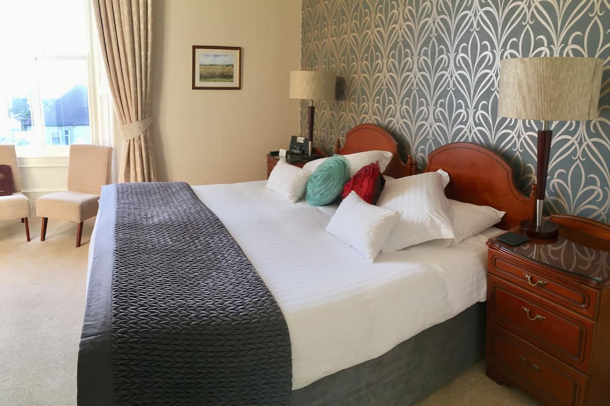 Premium bedding, blackout curtains, iron/ironing board (on request)