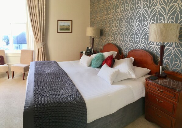 Premium bedding, blackout curtains, iron/ironing board, free WiFi