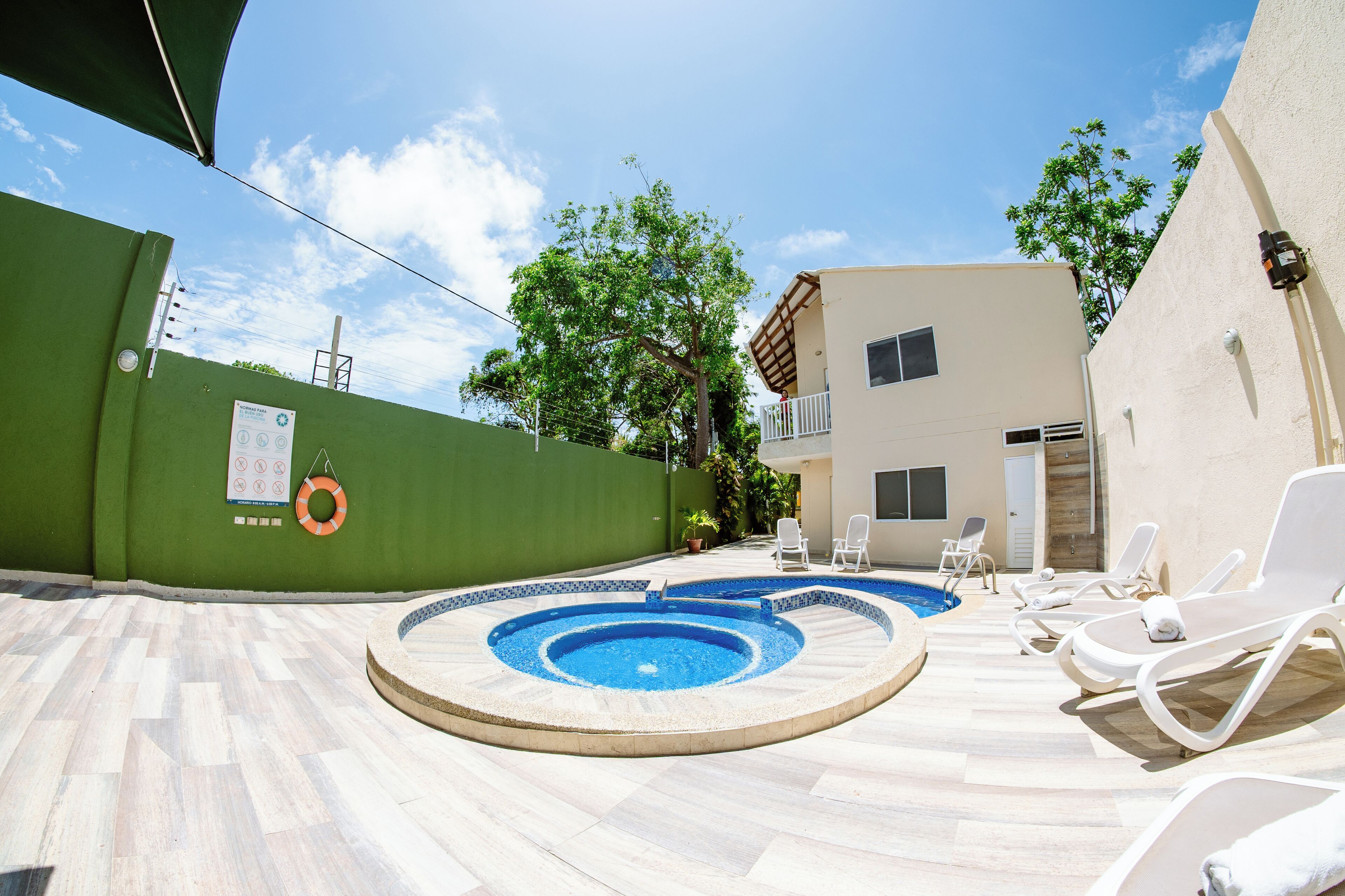 Outdoor pool, open 7 AM to 8 PM, pool loungers