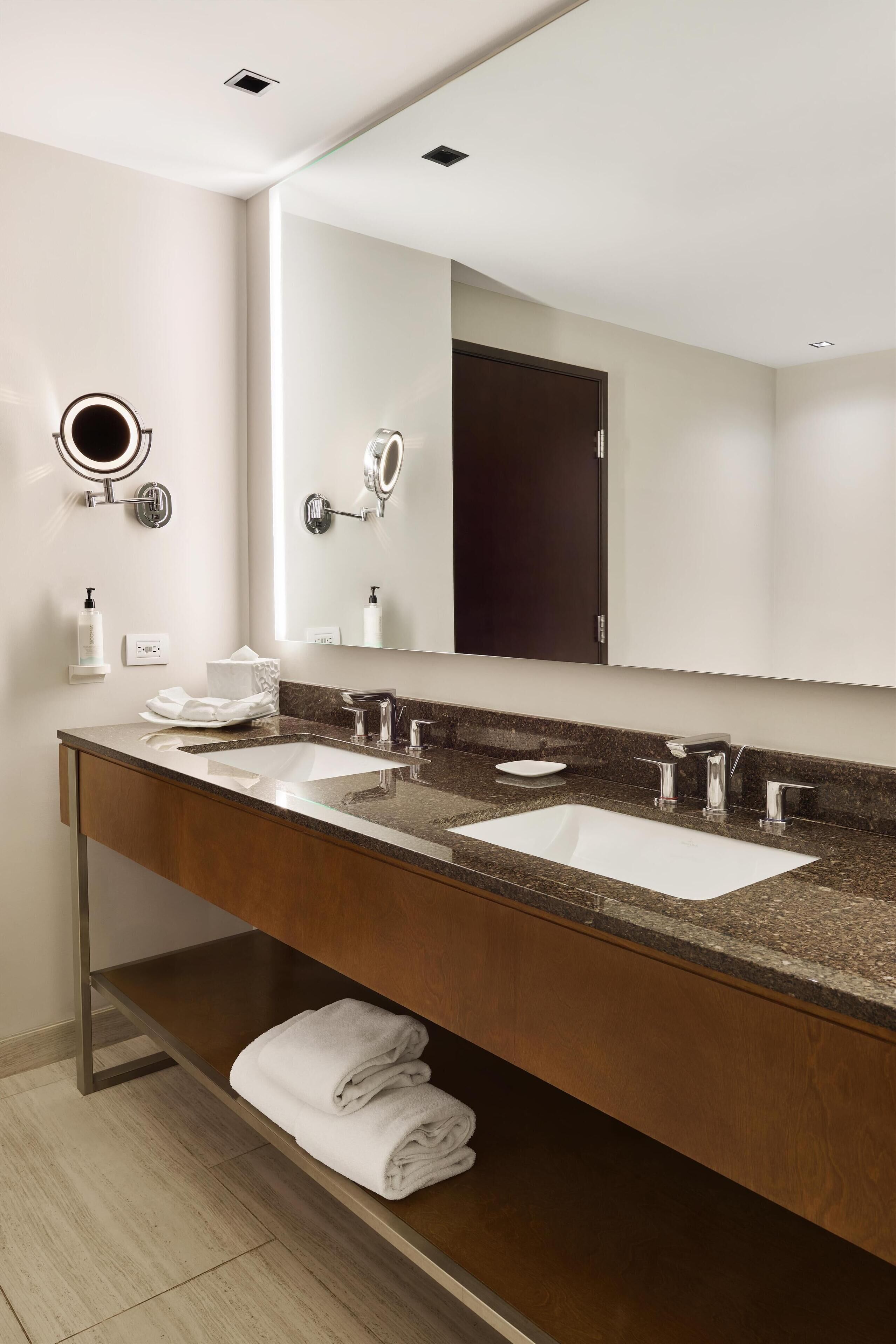 designer toiletries, hair dryer, towels