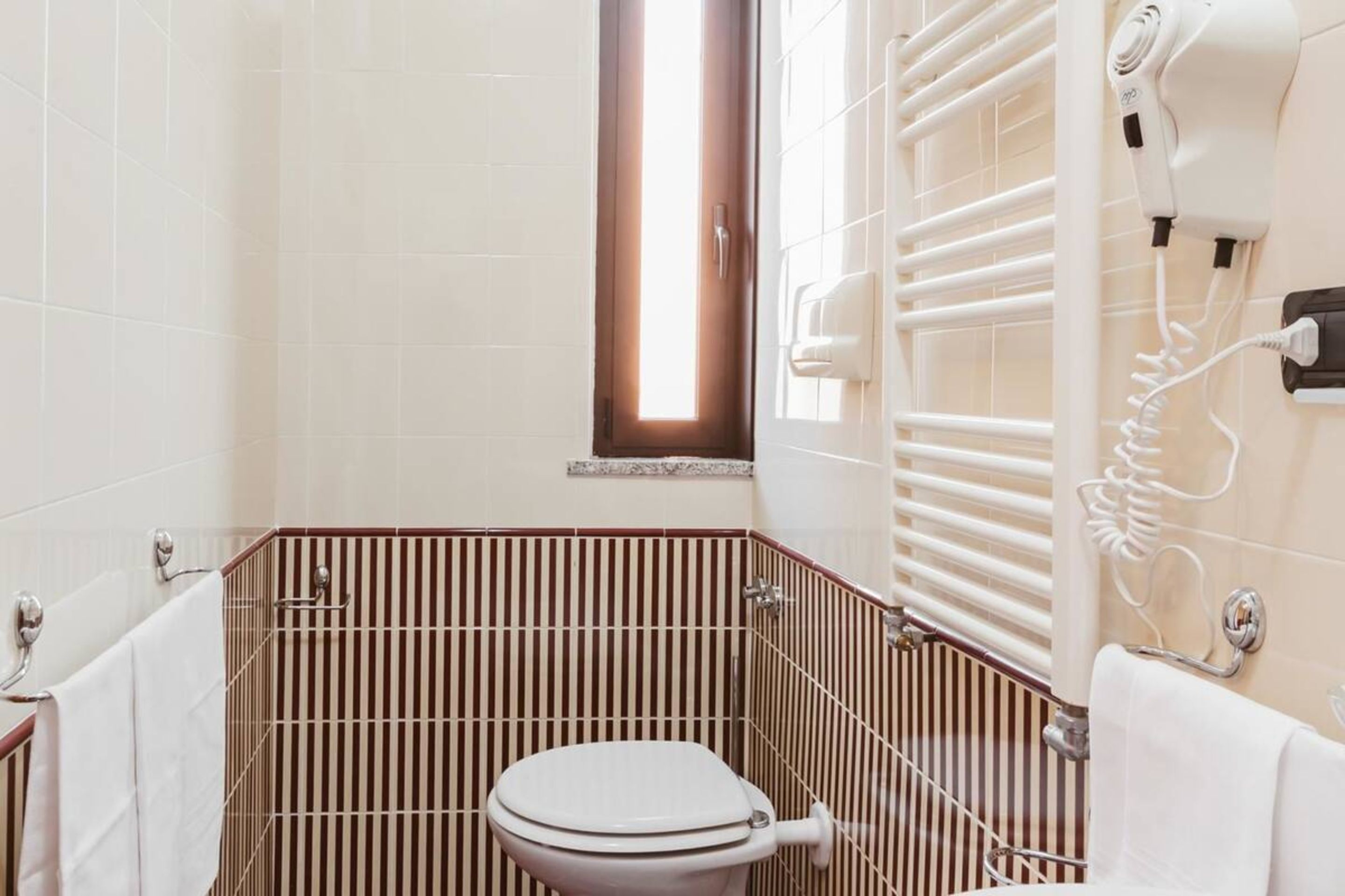 free toiletries, hair dryer, slippers, bidet