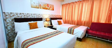 A hotel room with two beds, a red sofa, an air conditioning unit, and a decorative wall piece.