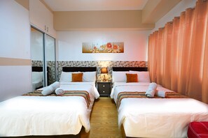 Deluxe Quadruple Room, 2 Double Beds, Kitchen, Courtyard View | Free WiFi, bed sheets, wheelchair access - Cedar Peak Condominium by Tripsters Hub (Baguio)