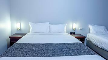 Premium bedding, pillow-top beds, desk, laptop workspace