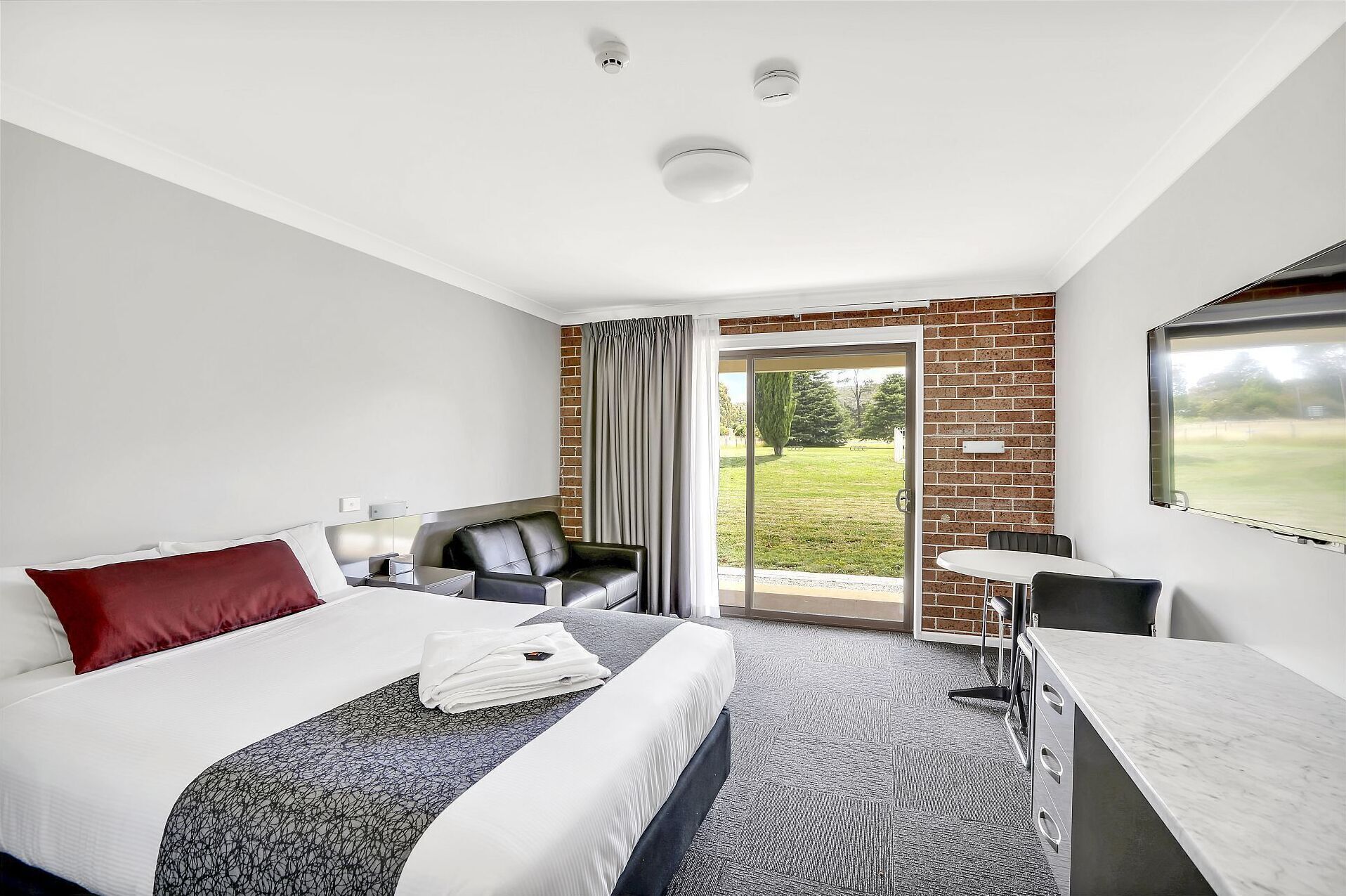 Premium bedding, pillowtop beds, desk, laptop workspace