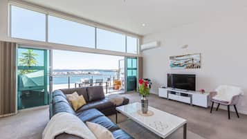 Deluxe Penthouse, 3 Bedrooms, Ocean View, Oceanfront | Living area | 50-inch flat-screen TV with digital channels, TV, Netflix