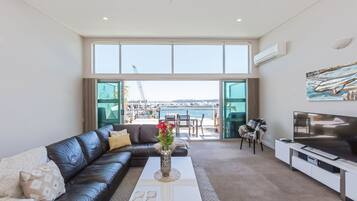 Deluxe Penthouse, 3 Bedrooms, Ocean View, Oceanfront | Living area | 50-inch flat-screen TV with digital channels, TV, Netflix