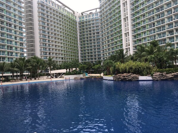 4 outdoor pools, open 7 AM to 7 PM, pool umbrellas, sun loungers