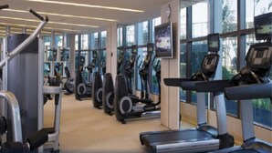 A gym with treadmills, elliptical machines, and weight equipment. - Gin Mao Yuan Hotel Shenzhen (Shenzhen)