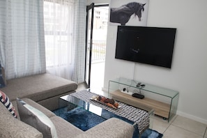 Apartment, 1 Bedroom | Living room | Smart TV, DVD player - Placeview Inn (Johannesburg South)