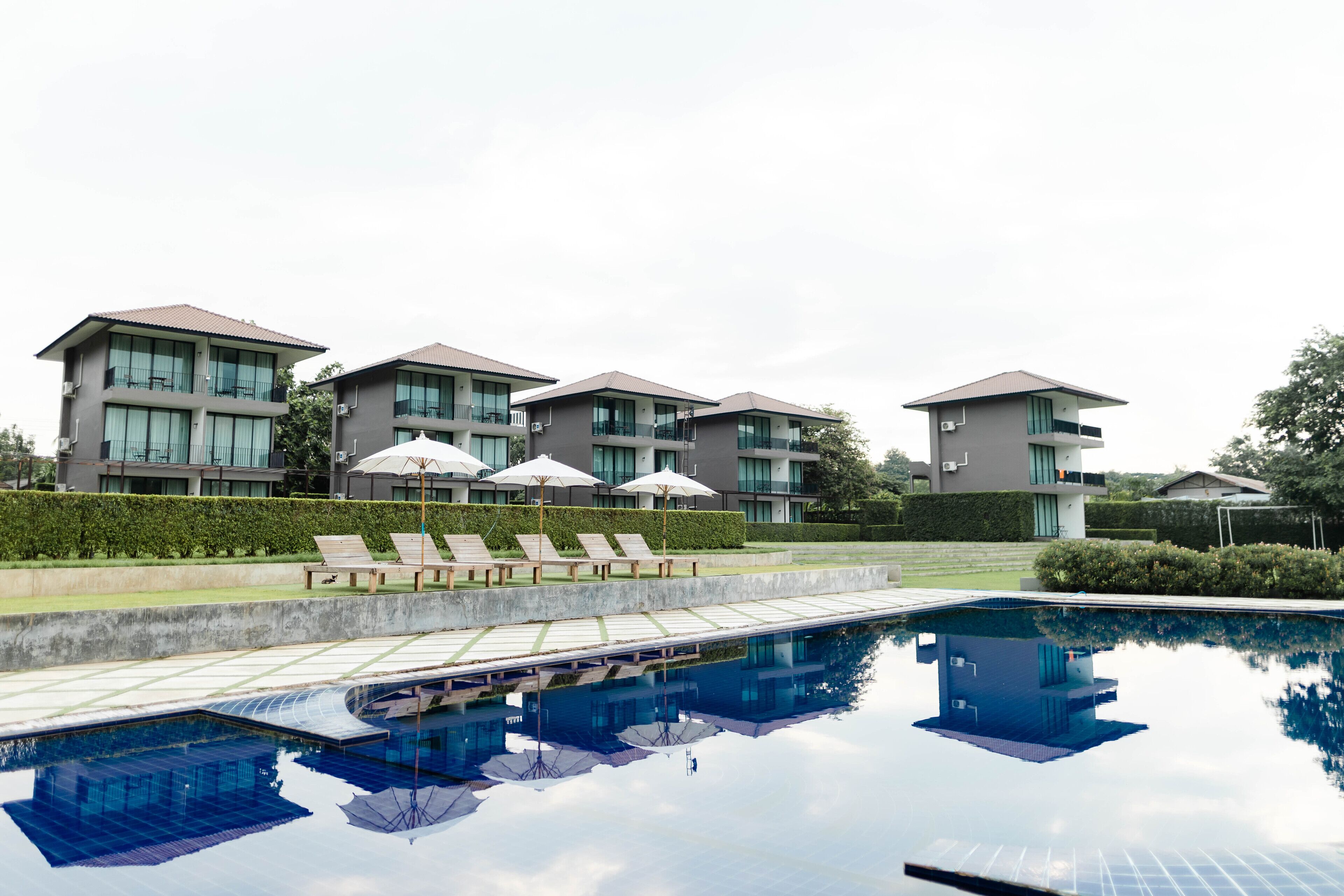 Outdoor pool, open 7:00 AM to 9:00 PM, pool umbrellas