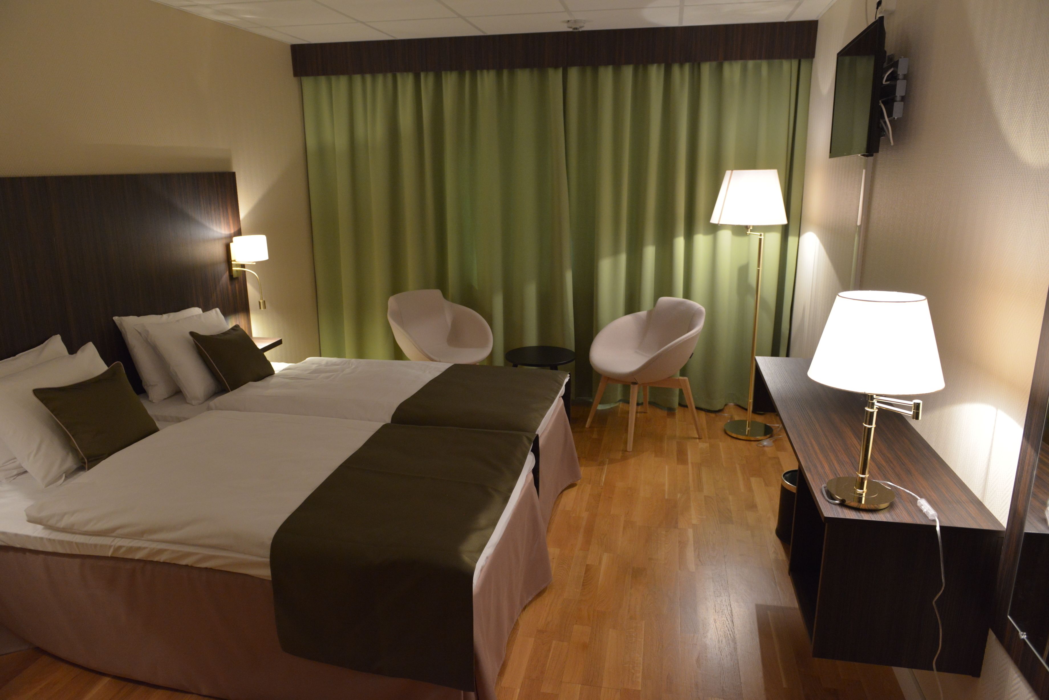 twin room | desk, laptop workspace, blackout curtains, iron/ironing board