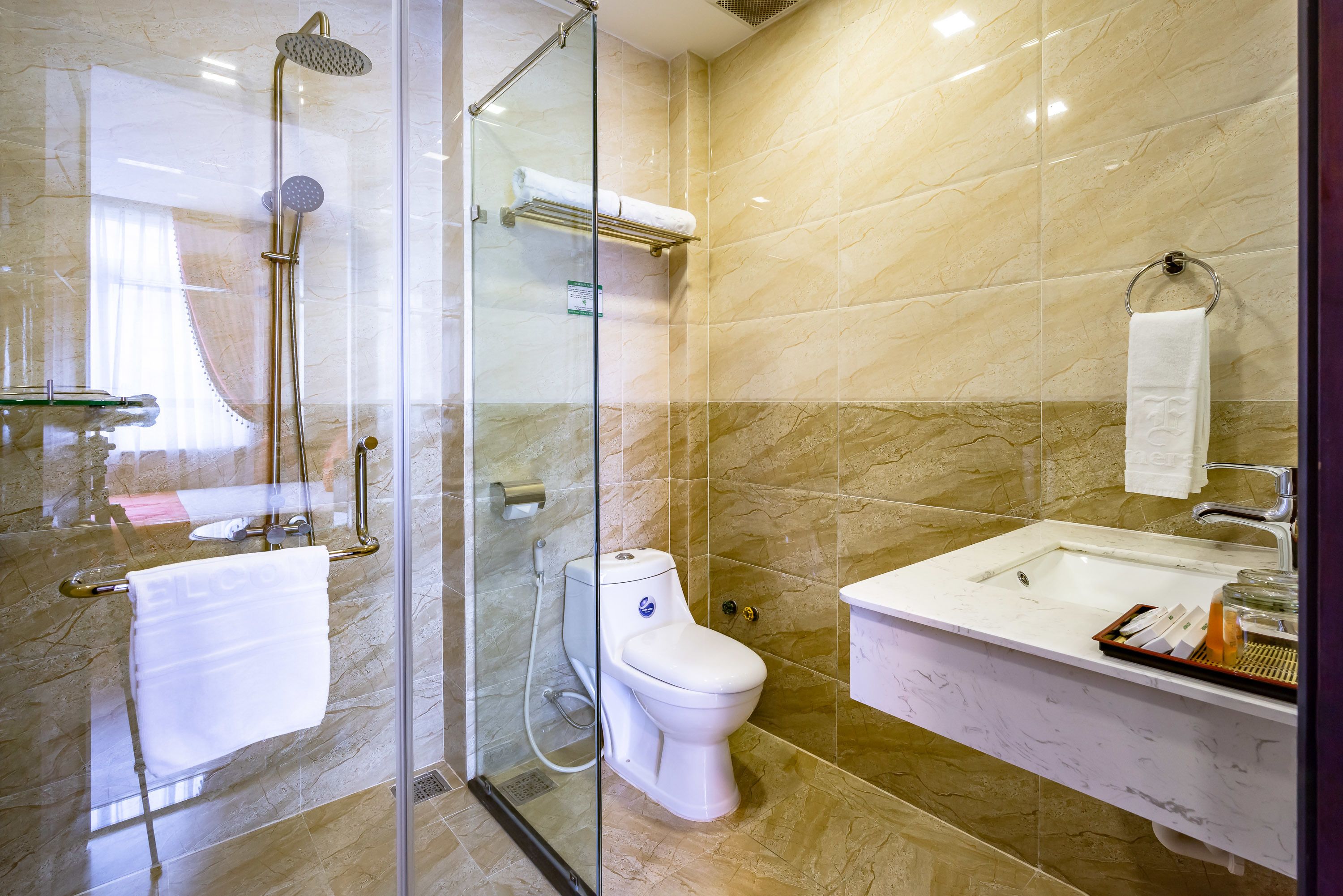 one bedroom deluxe apartment | bathroom | shower, free toiletries, hair dryer, slippers