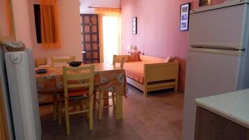 Apartment, 1 Bedroom | Living area | Flat-screen TV