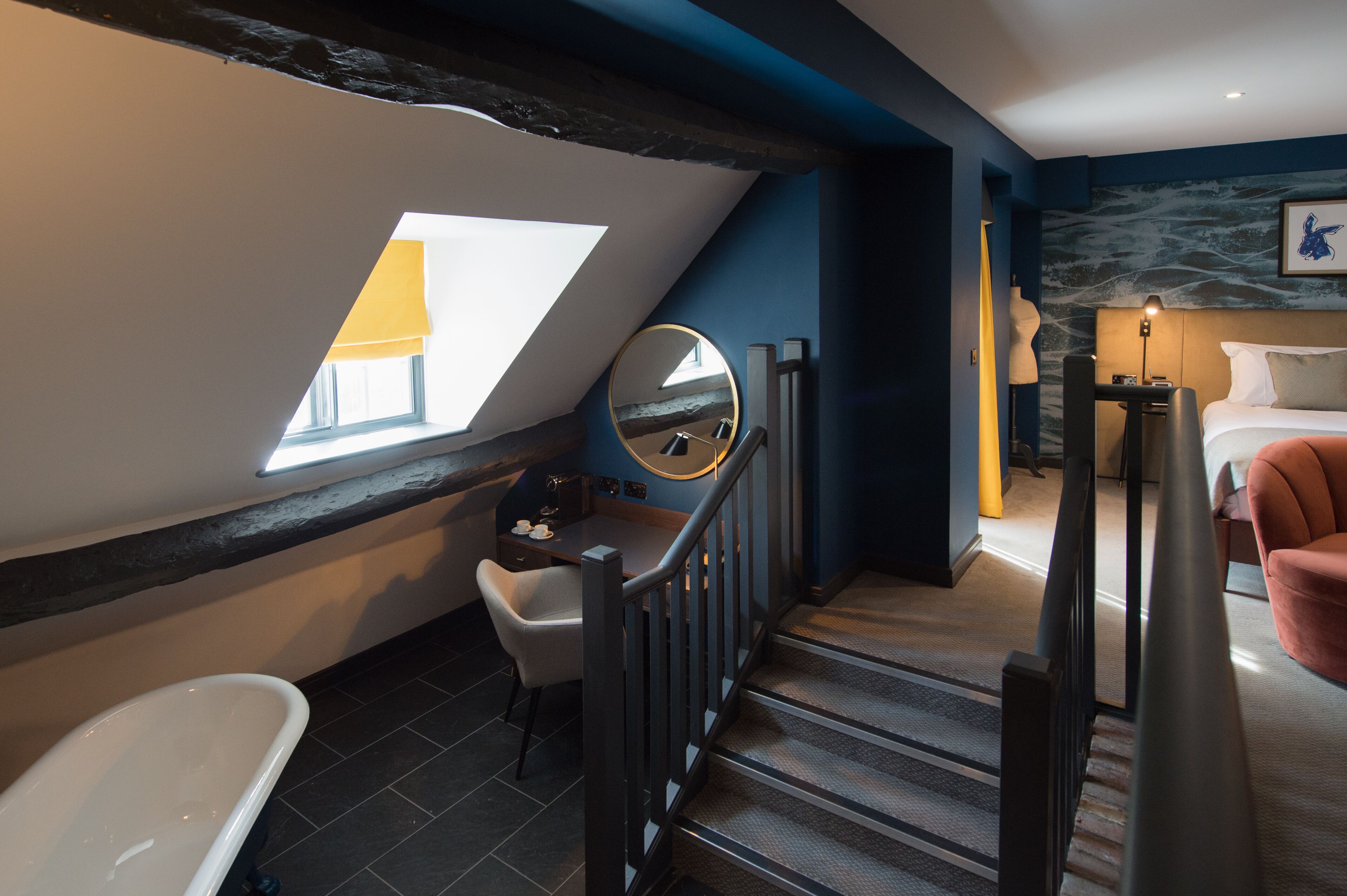 junior suite | in-room safe, desk, blackout curtains, iron/ironing board