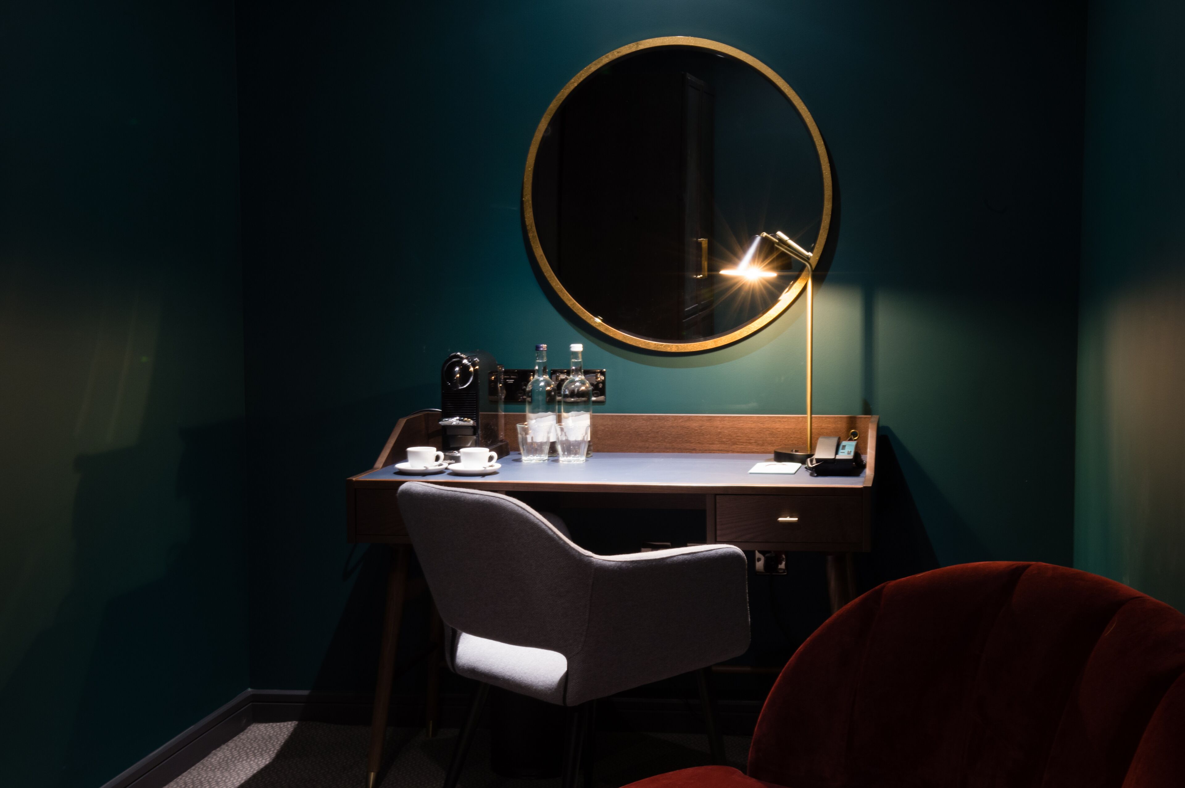 signature suite | in-room safe, desk, blackout curtains, iron/ironing board