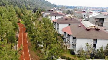 A residential area with multiple two-story houses featuring pitched roofs and dormer windows.