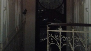 A grand entrance with a large, ornate door and a decorative ceiling. - Art Hostel (Kraków)