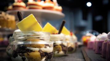 A dessert display with various sweets and pastries.