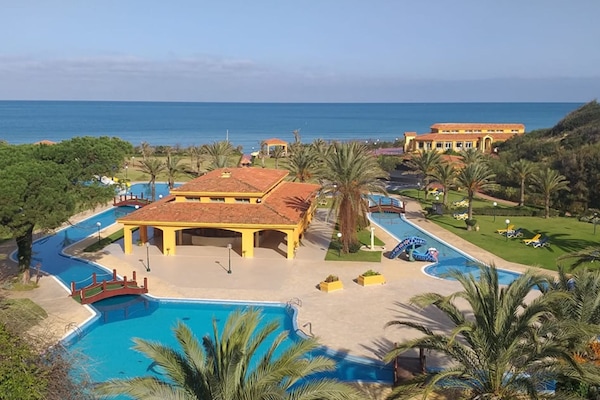 Indoor pool, outdoor pool, pool umbrellas, sun loungers