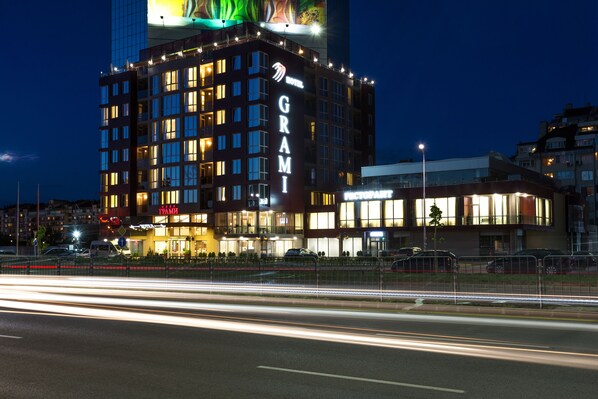 A hotel with a prominent 'GRAMI' sign, multiple floors, and a modern facade. - Grami Hotel Sofia (Sofia)