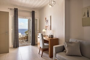 Deluxe Suite | Poolside with Sea view | Living area | 42-inch flat-screen TV with cable channels, TV, printers - Selana Suites (Sifnos)