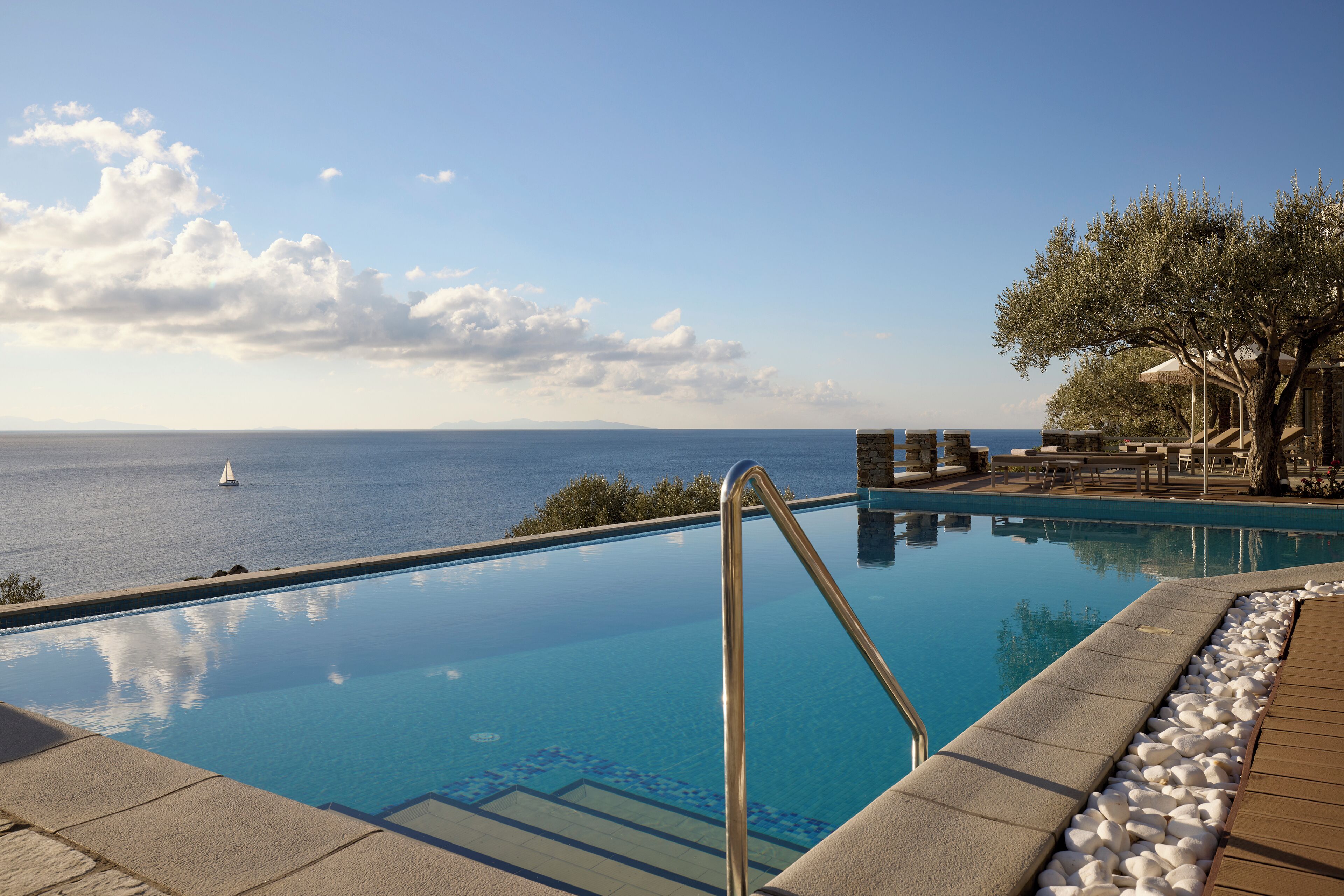 Seasonal outdoor pool, open 9:00 AM to 8:00 PM, pool umbrellas