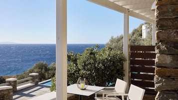 Deluxe Suite | Poolside with Sea view | Terrace/patio