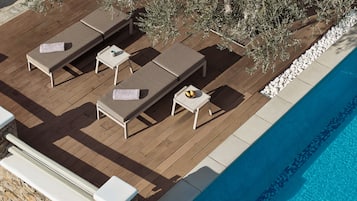 Seasonal outdoor pool, open 9:00 AM to 8:00 PM, pool umbrellas