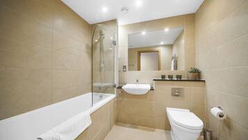 Superior Apartment, 2 Bedrooms | Bathroom | Combined shower/tub, free toiletries, hair dryer, towels
