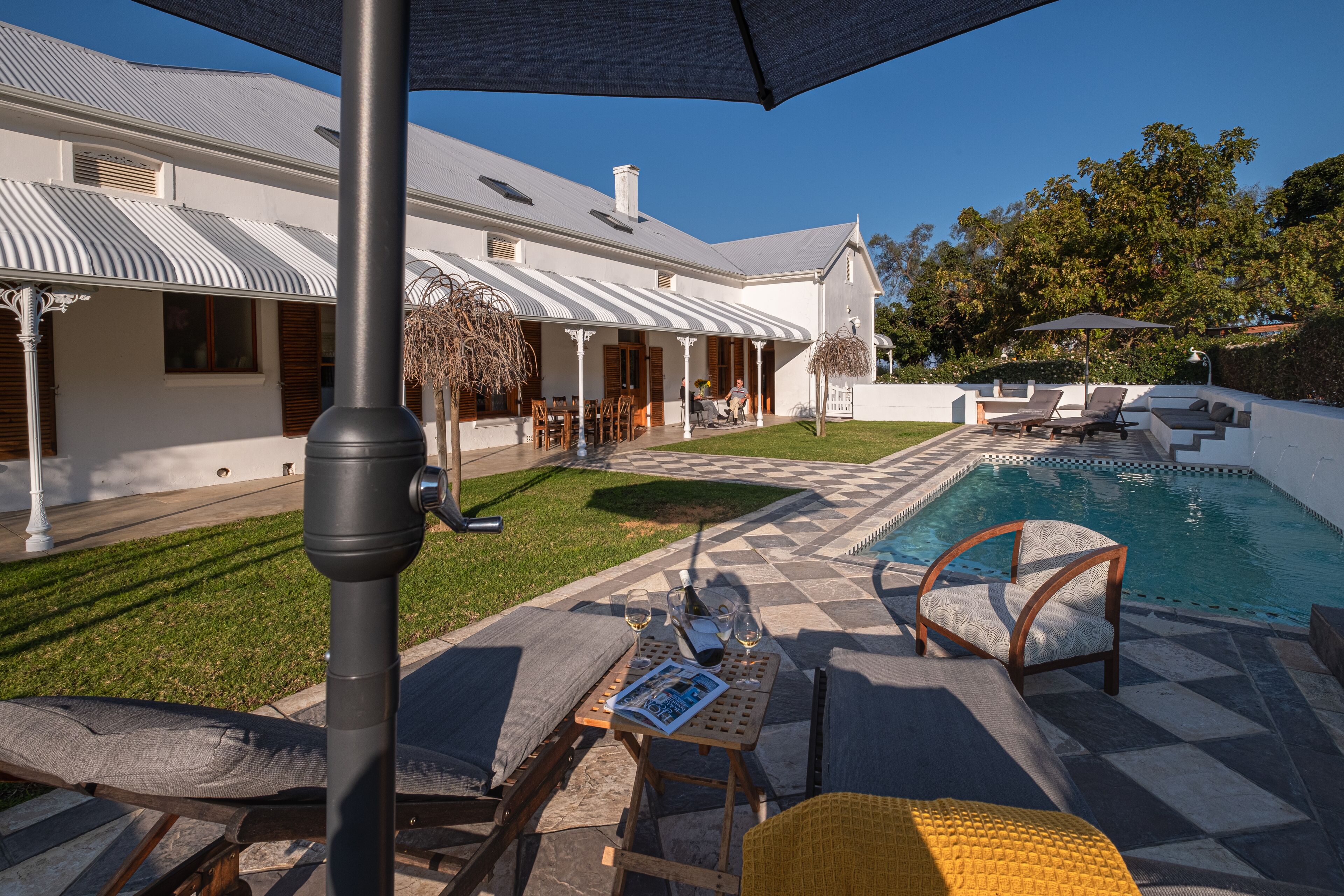 Seasonal outdoor pool, open 9 AM to 7 PM, pool umbrellas, sun loungers