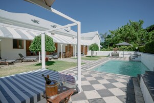 Seasonal outdoor pool, open 9 AM to 7 PM, pool umbrellas, sun loungers