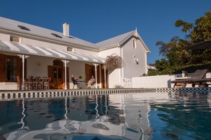 Seasonal outdoor pool, open 9 AM to 7 PM, pool umbrellas, pool loungers