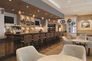 Enjoy a drink at the bar, where you can sit at the counter or a table, and relax with friends.