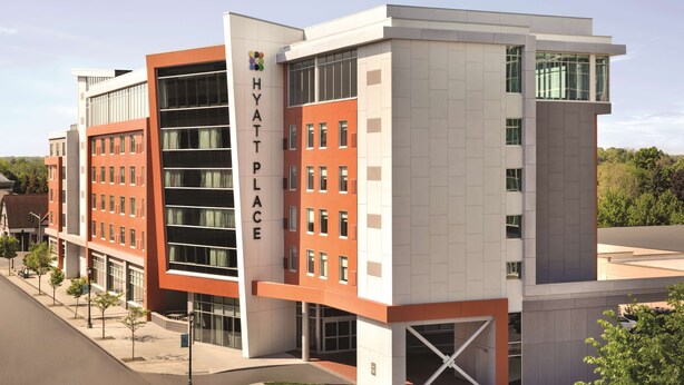 A modern hotel building with a prominent 'Hyatt Place' sign, multiple floors, and a mix of brick and glass facades. - Hyatt Place Niagara Falls (Niagara Falls)