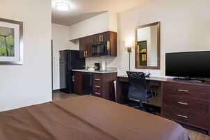 Desk, laptop workspace, blackout drapes, iron/ironing board