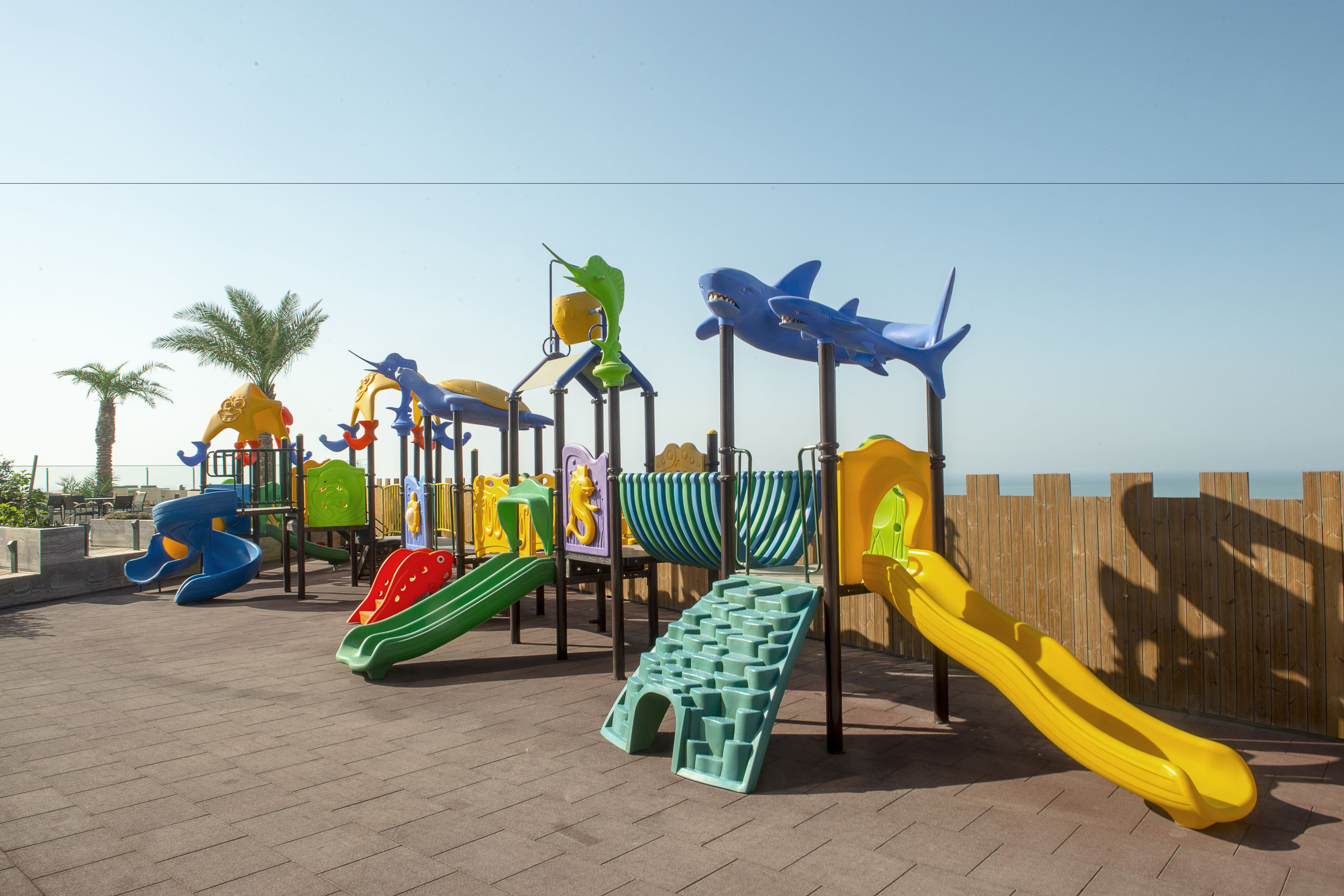 A playground with various slides and climbing structures.