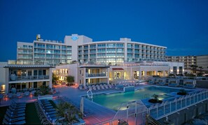 A hotel with a pool, multiple balconies, and a rooftop bar. - Hard Rock Hotel Daytona Beach (Daytona Beach)