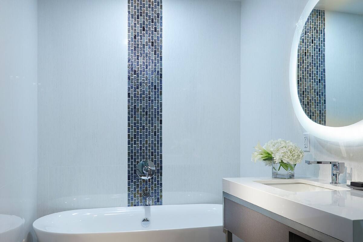 rainfall showerhead, designer toiletries, hair dryer, towels