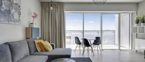 Departamento Confort, 1 habitación | Área de sala de estar | Televisión de pantalla plana