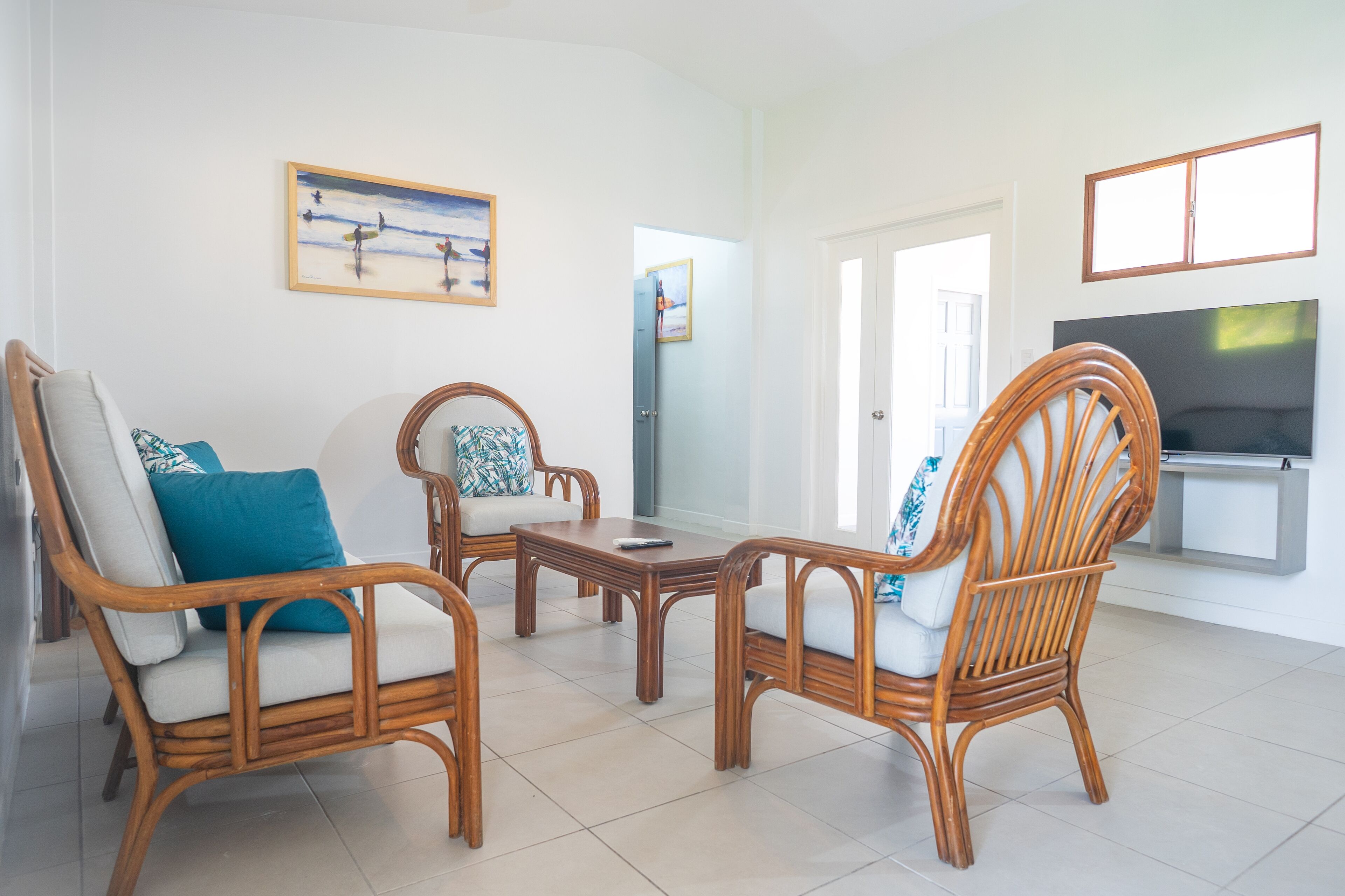 three-bedroom apartment | living area | flat-screen tv