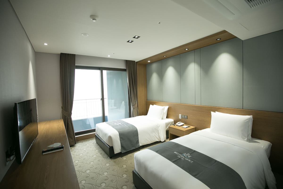 Premium bedding, desk, laptop workspace, blackout curtains